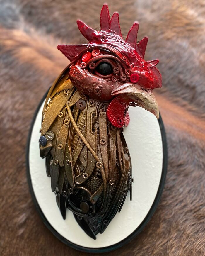 Rooster sculpture made from trash showcasing stunning animal sculptures using recycled materials in detailed art form.