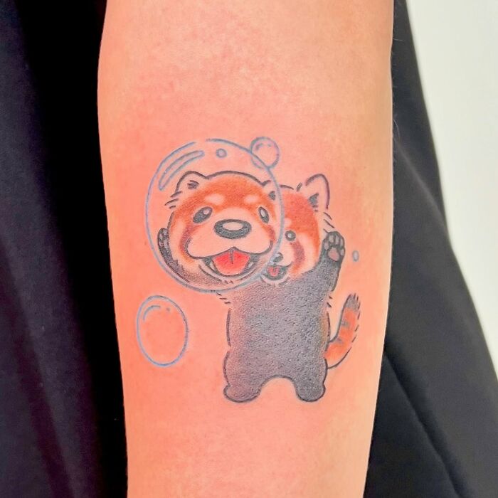 Red panda animal tattoo with bubbles on forearm in adorable style by Korean artist Buoy.