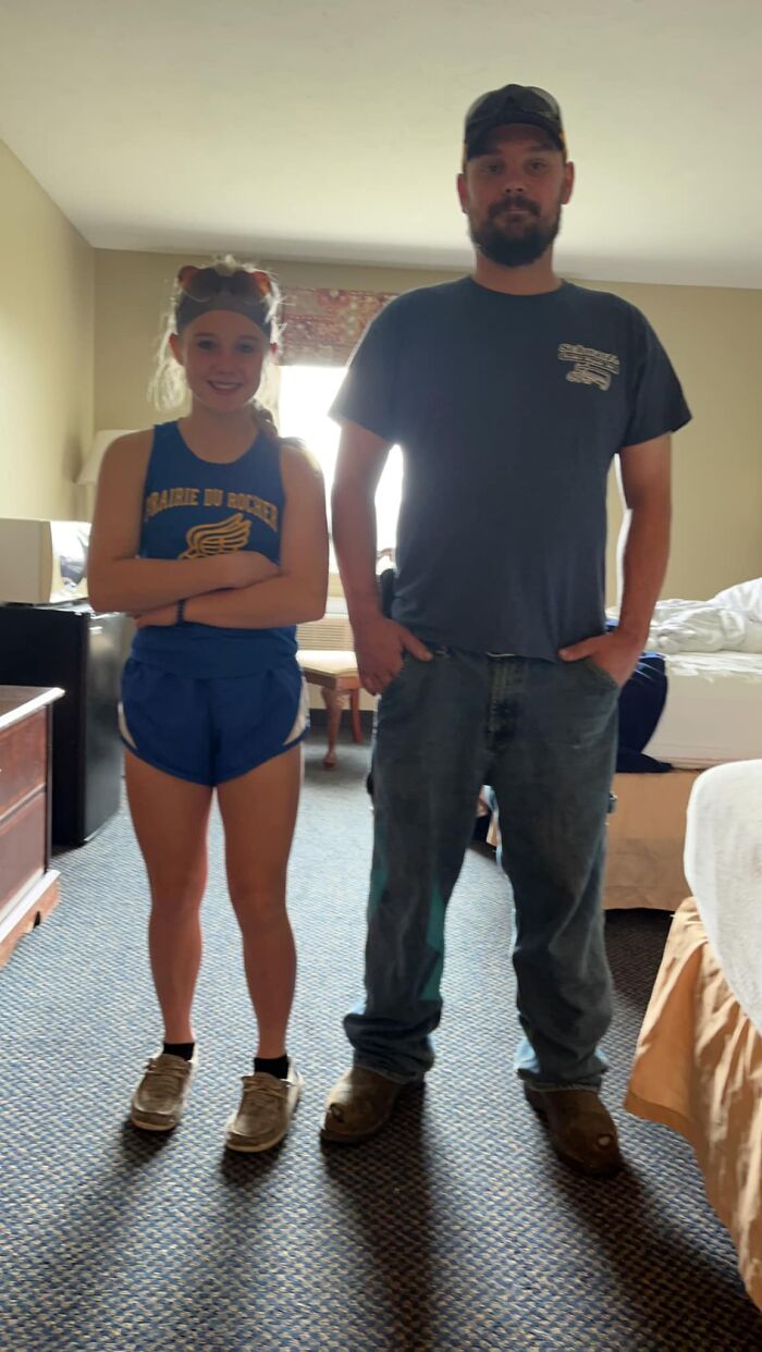 Father and teenage daughter standing side by side indoors in casual clothes, illustrating a soul-crushing family tragedy. Father and teenage daughter standing side by side indoors in casual clothes, illustrating a soul-crushing family tragedy.