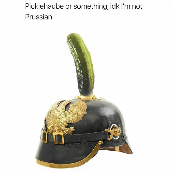 Humorous meme featuring a historic Prussian helmet with a pickle on top, challenging history knowledge humorously.