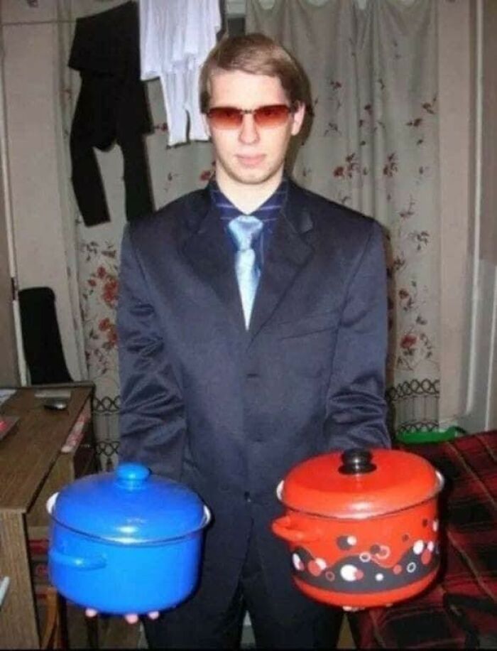 Young man in sunglasses holding colorful cooking pots, a relatable image for people raised in Eastern Europe.