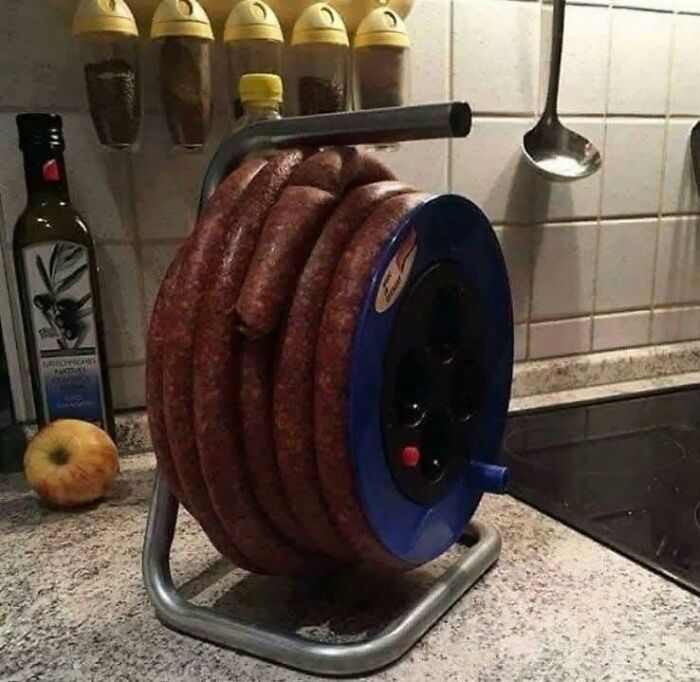 Coiled homemade sausage resembling a kitchen extension cord reel, a quirky meme relatable to Eastern Europe culture.