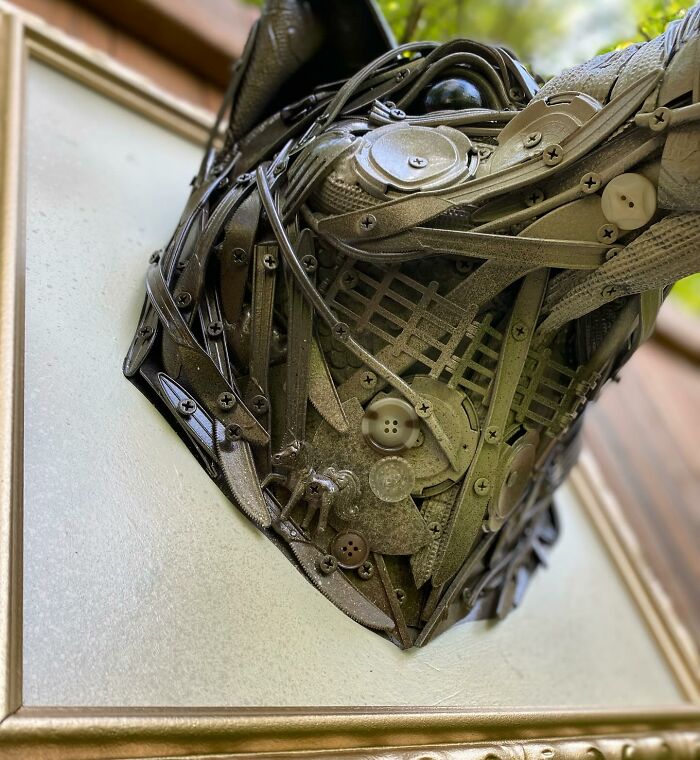 Sculpture of an animal head made from repurposed trash, showcasing stunning recycled materials and artistic creativity.