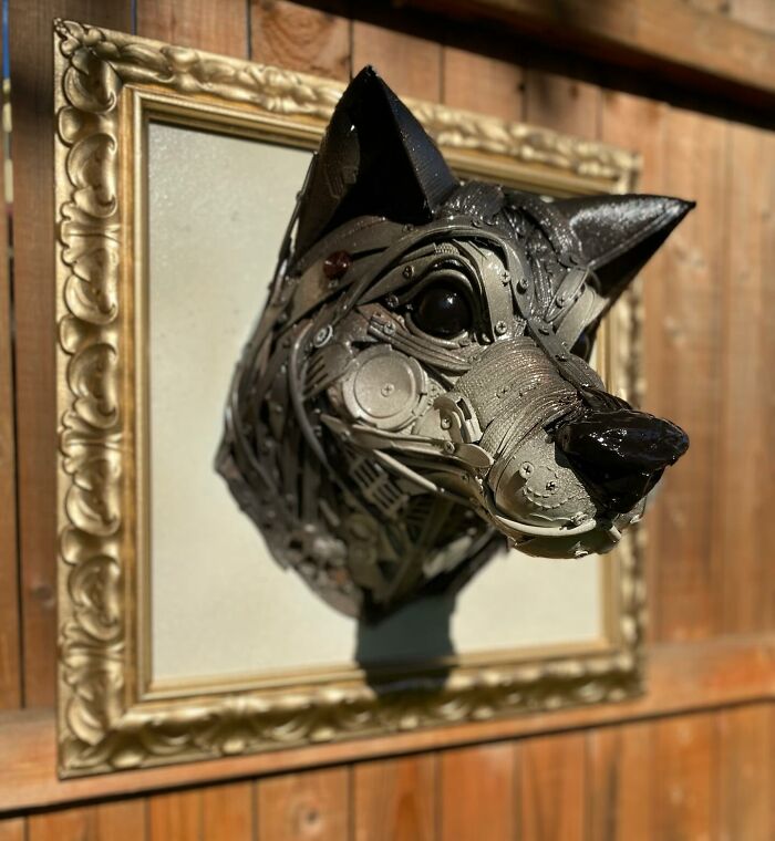 Sculpture of an animal head made from repurposed trash, showcasing stunning recycled materials and artistic creativity.