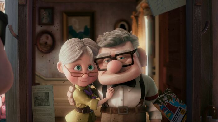 Elderly animated couple embracing warmly, reflecting life-changing sentences tattooed on their hearts in a heartfelt moment.