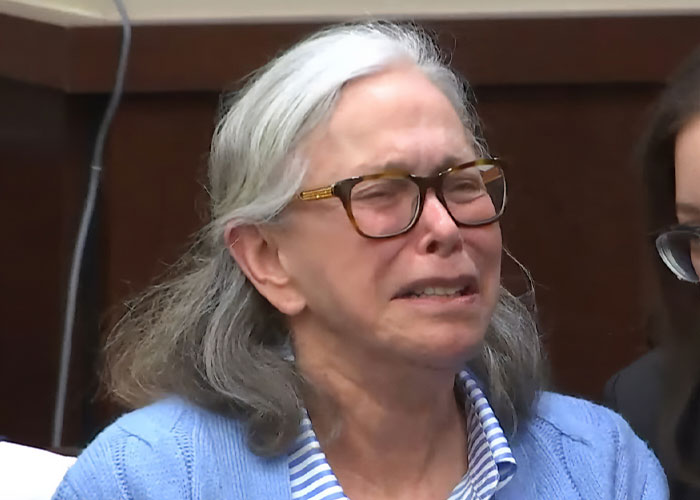 Elderly woman with gray hair and glasses crying during court meltdown in viral juror story about ex-son-in-law plot.