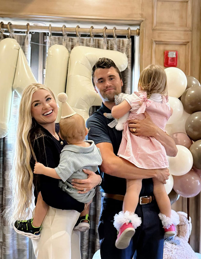 Family photo with Erika Kirk holding children at a celebration event, related to justice for husband&rsquo;s assassin.