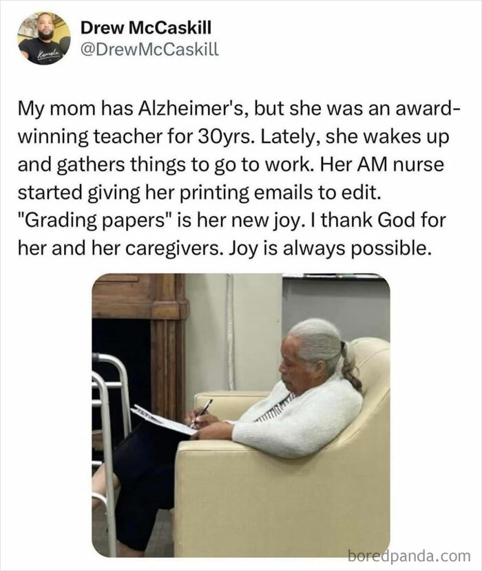 Elderly woman with Alzheimer’s joyfully grading papers, highlighting heartwarming stories cleansing negativity from social feeds.