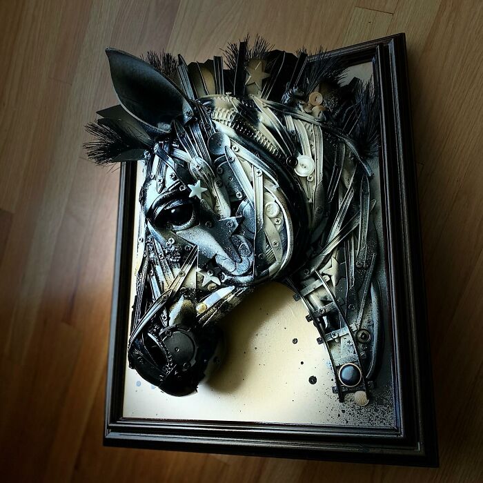 Horse sculpture made from recycled trash and metal parts, showcasing stunning animal sculptures in a framed wall art piece.
