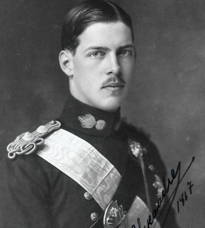 Black and white portrait of a young man in military uniform, related to famous people lost in animal attacks.