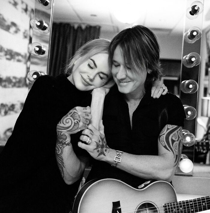 Nicole Kidman and Keith Urban sharing a tender moment with guitar, highlighting split and hilarious reactions.
