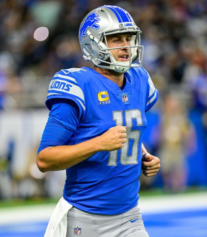 Detroit Lions quarterback in action on the field, representing the highest paid athletes of 2025.