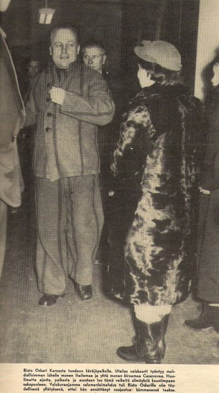 Black and white photo of people at an event related to famous fraud cases in a historical setting.