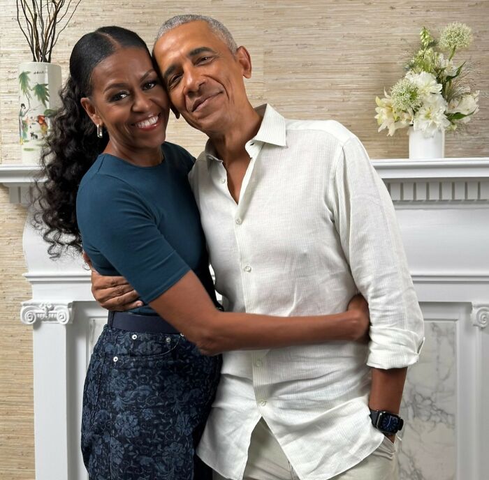 Barack Obama and Michelle Obama smiling and embracing, showing their relationship after presidency challenges. Barack Obama and Michelle Obama smiling and embracing, showing their relationship after presidency challenges.