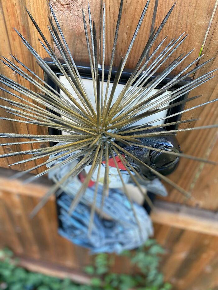 Intricate animal sculpture made from recycled trash and metal parts showcasing creative transformation and artistic craftsmanship.