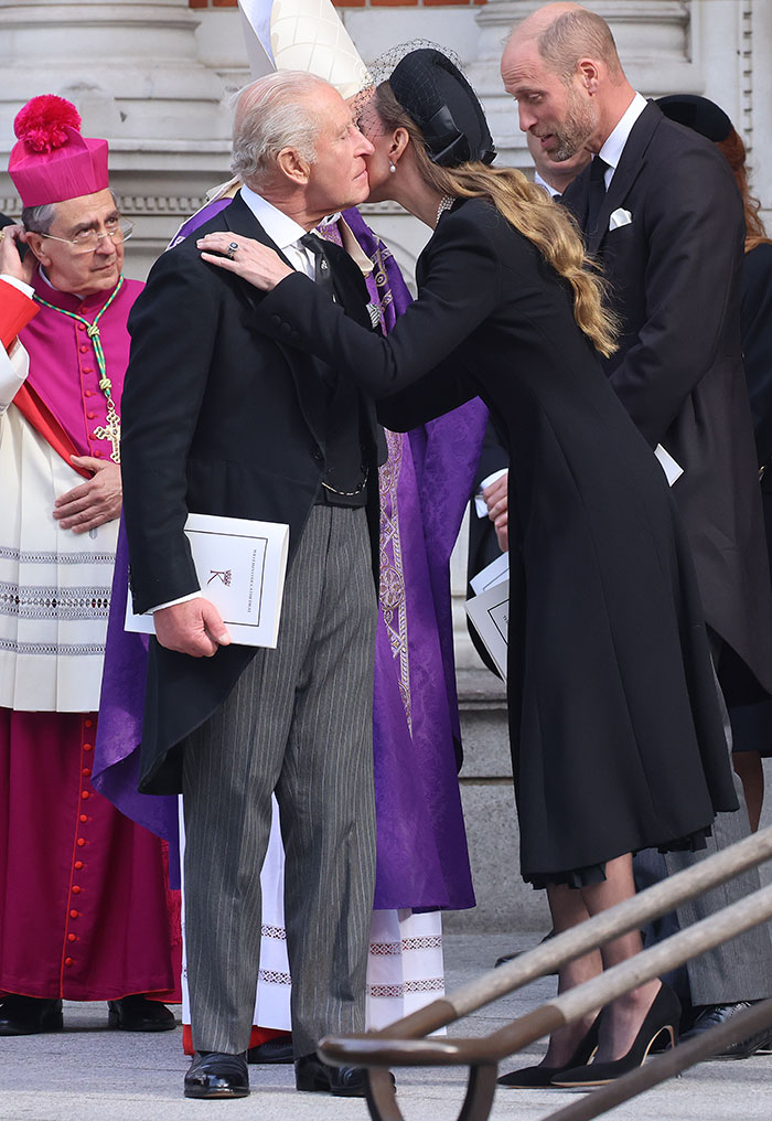 Kate Middleton kindly saying goodbye to King Charles with a kiss on the cheek after royal funeral event.