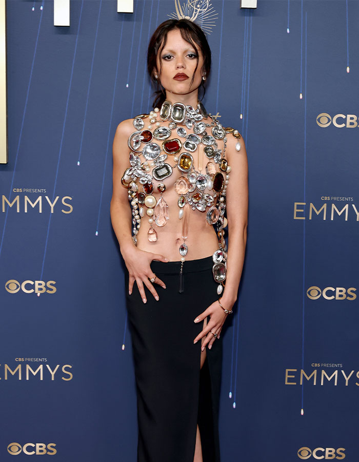 Jenna Ortega at the Emmys wearing a jeweled outfit, styled by her stylist after a viral painful wardrobe moment.