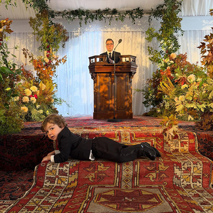 Wedding scene with floral decorations and ornate carpet, highlighting Taylor Swift stealing the spotlight at Selena Gomez's wedding speech.