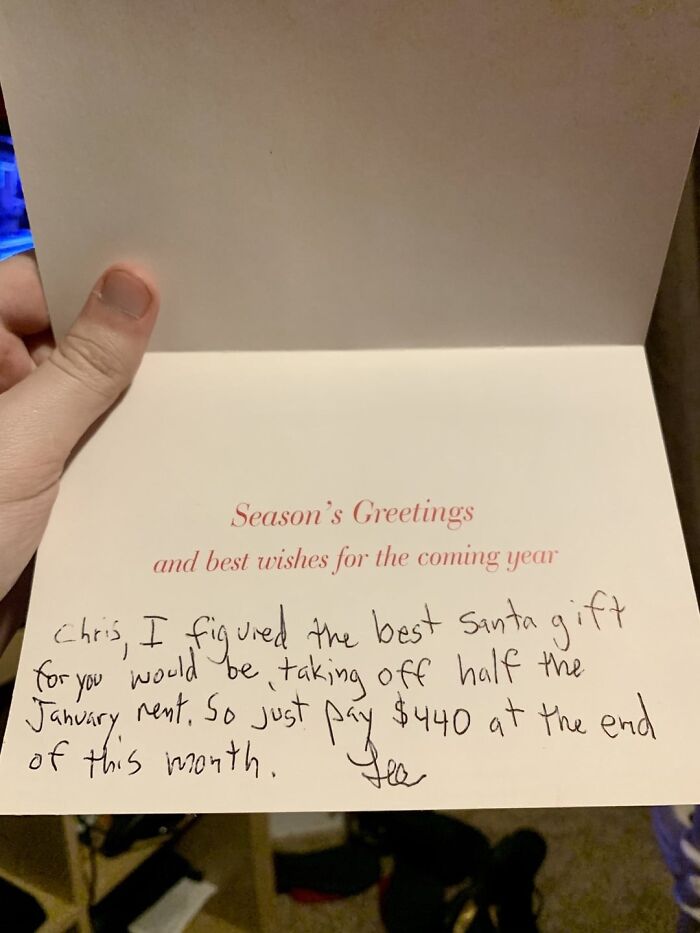 Handwritten holiday card with a warm message offering to pay half the rent as a wholesome post for distraction.