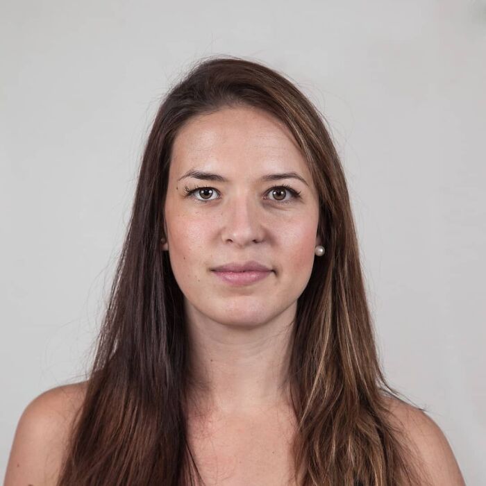 Woman with long brown hair and natural makeup, shown in a genetic portrait highlighting family DNA similarities.