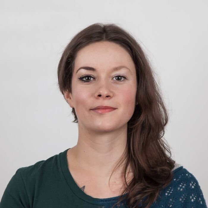 Young woman with expressive eyes and natural look, illustrating family DNA resemblance in genetic portraits concept.