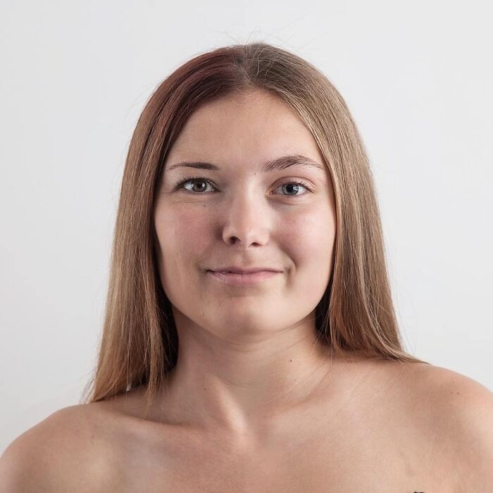 Close-up portrait of a young woman with long hair, showcasing strong family DNA in a genetic portrait style.