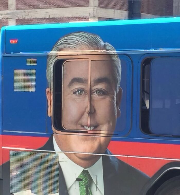Bus advertisement with a man's face distorted by window placement, a clear example of advertising placement fails that made people laugh.