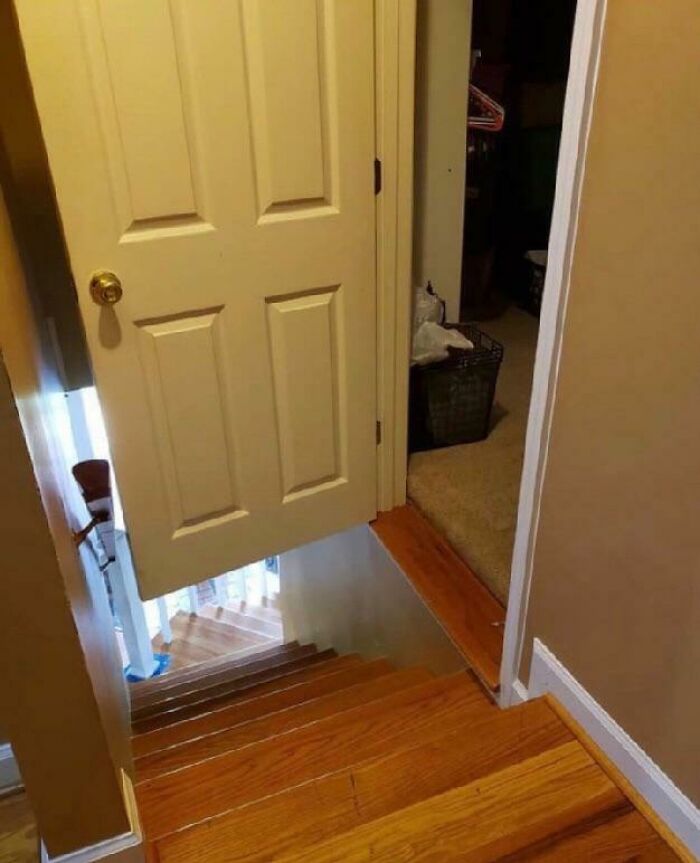 Half door installed over staircase with poor workmanship in a hilariously bad job done by someone rushing to finish it.