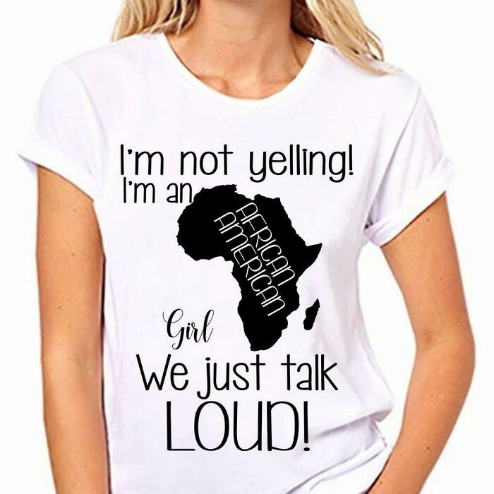 Woman wearing a white t-shirt with an Africa map graphic and black text about talking loud, related to social media failures.