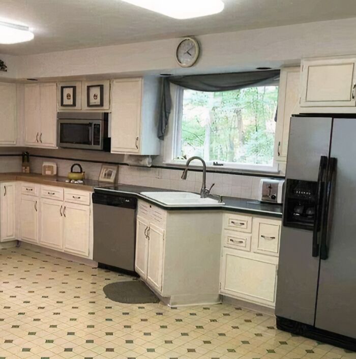 Kitchen renovation with uneven flooring and poorly done cabinets, a hilariously bad job that shows lack of care to get it over with.