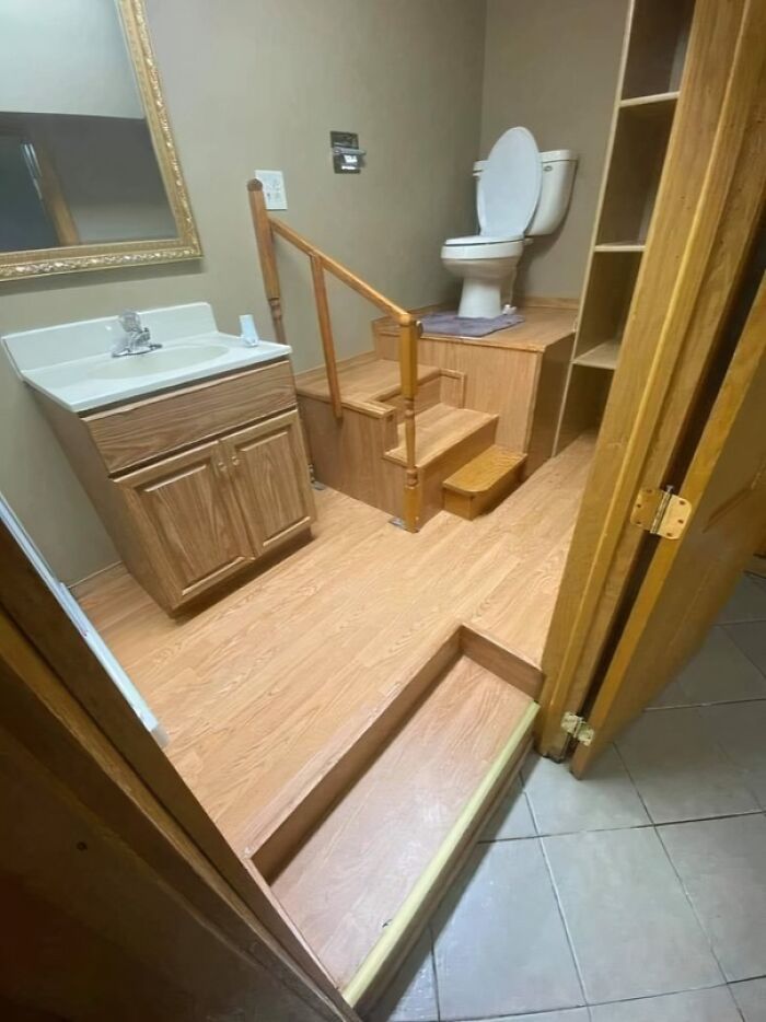 Bathroom renovation with hilariously bad job on stairs and toilet installation showing poor workmanship.