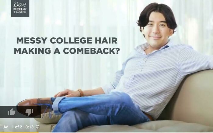 Young man with messy hair sitting on a couch in a casual pose, illustrating common Photoshop fails.