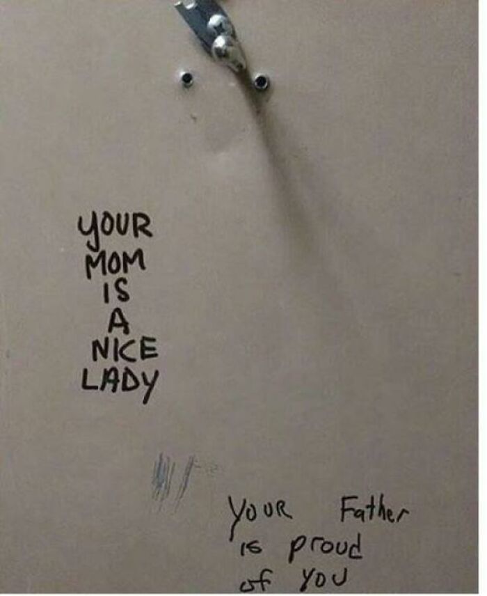 Bathroom stall vandalism with positive messages saying your mom is a nice lady and your father is proud of you, lighthearted public property vandalized