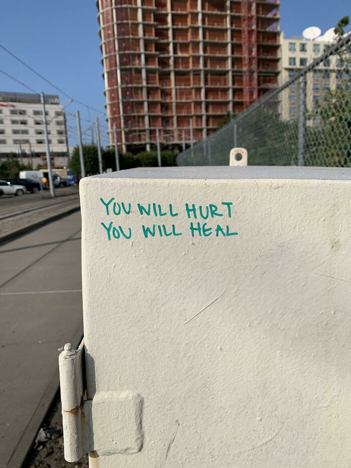 Graffiti on public property reads you will hurt you will heal, an example of creative vandalized public property.