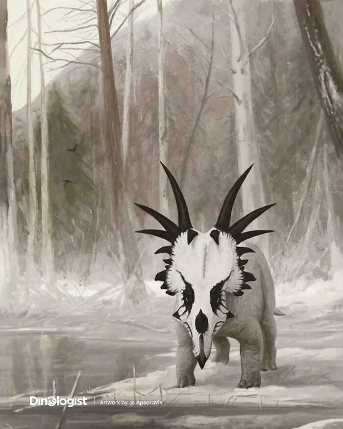 Extinct creature with metal-like spiked skull walking in a snowy prehistoric forest landscape.