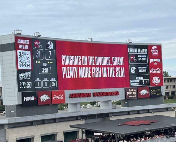 Scoreboard with a humorous message about divorce, showcasing hilariously random notes and signs that lighten the mood.