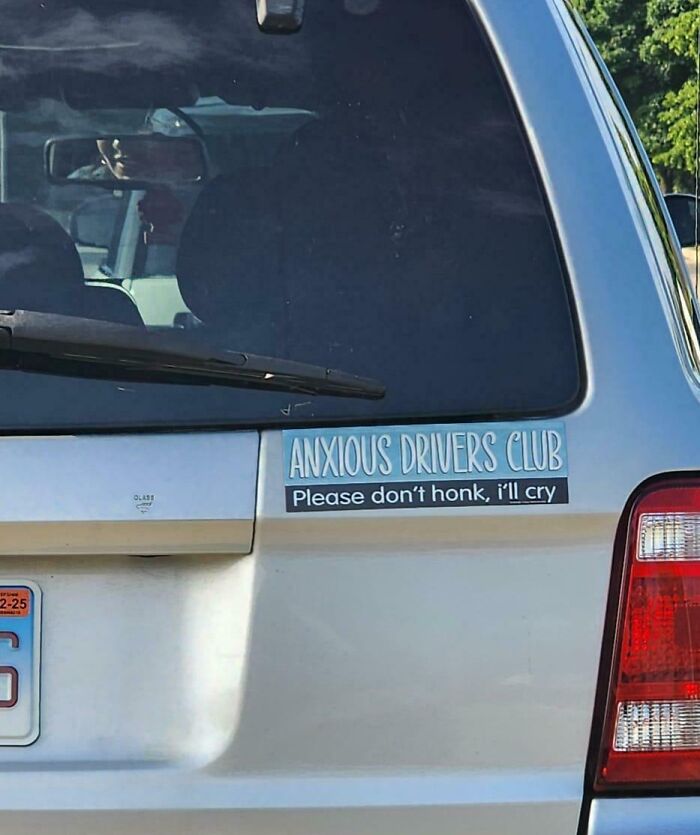 Sticker on car window saying "Anxious Drivers Club Please don't honk, I'll cry," showcasing random notes with humor.