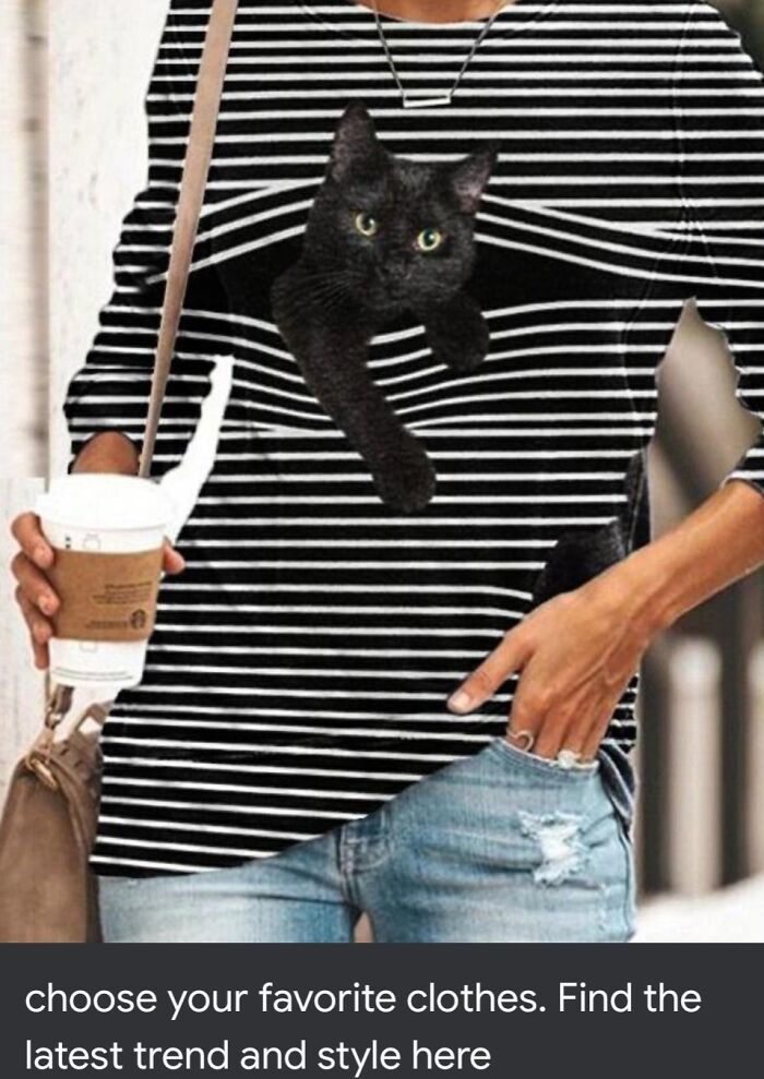 Woman wearing a striped shirt with a black cat poorly edited into the design, a clear Photoshop fail holding a coffee cup.