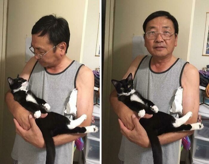 Man who said no pets holding and cuddling a black and white cat, showing a soft spot for pets at home.