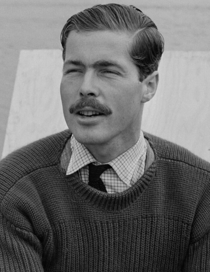 Black and white portrait of a man with mustache wearing a sweater and tie, related to celebrities who vanished without a trace.