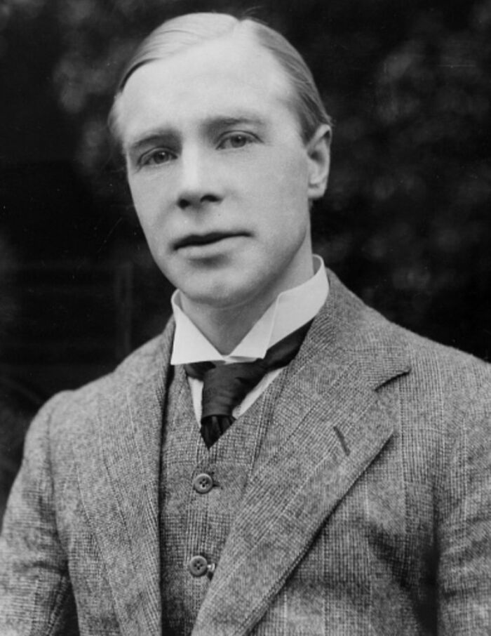 Black and white portrait of a young man wearing a suit, representing celebrities who vanished without a trace.
