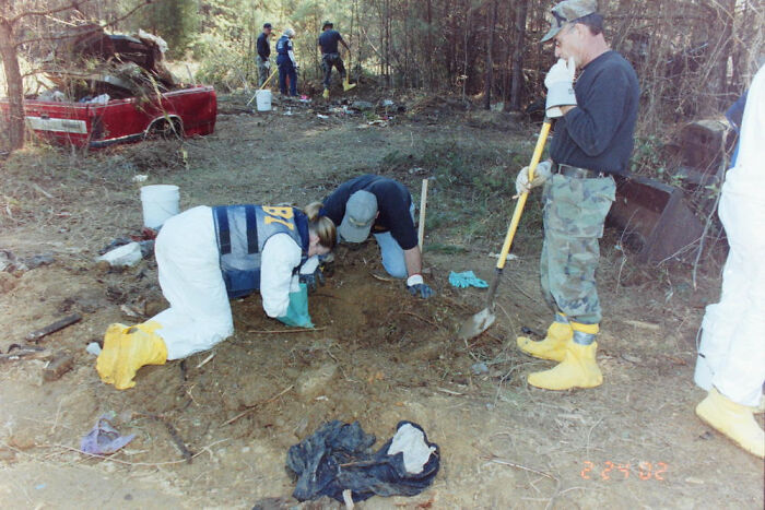 FBI agents and forensic team excavating a crime scene outdoors as part of terrifying photos and stories investigation.