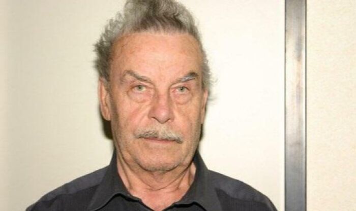 Elderly man with a serious expression, illustrating a terrifying photo from chilling stories collection.