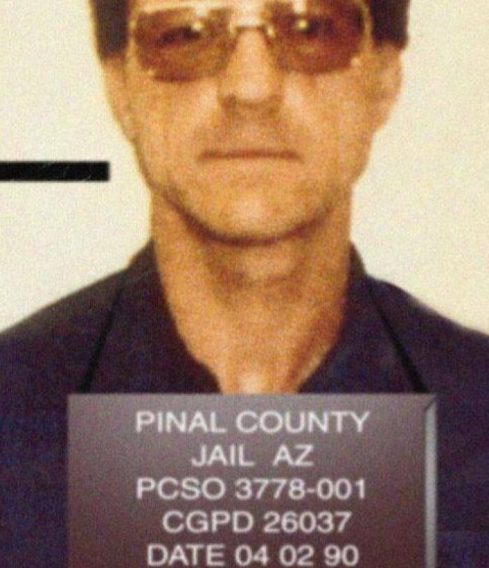 Mugshot of a man in sunglasses at Pinal County Jail, part of terrifying photos and stories that are fascinating and scary.
