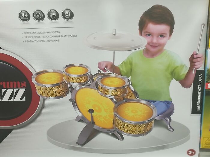 Boy with a toy drum set photoshopped with distorted proportions showing one of the worst Photoshop fails.