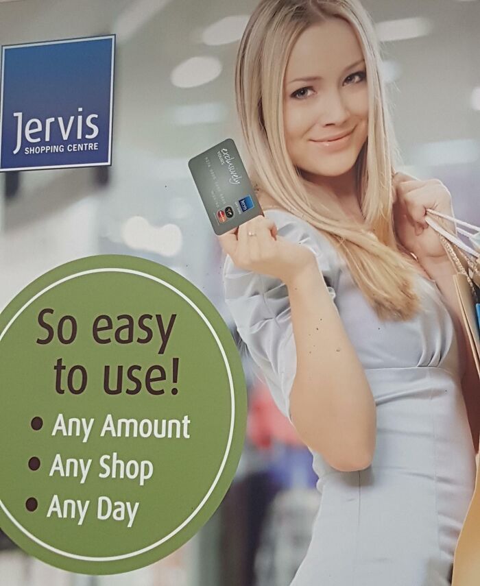 Blonde woman holding a credit card with distorted arm and hand, a clear example of Photoshop fails and editing errors.