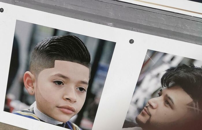 Photo featuring a boy with an unnatural haircut showcasing one of the most obvious Photoshop fails in image editing.