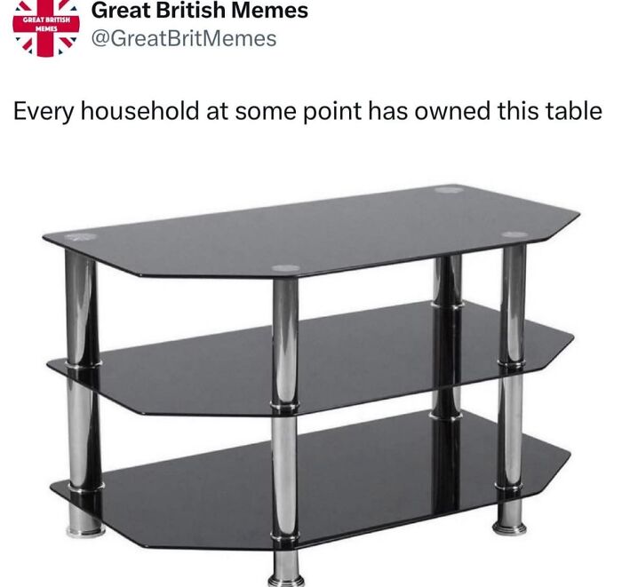 Black glass and chrome three-tiered table meme from a viral memes page known for chaotic random humor.