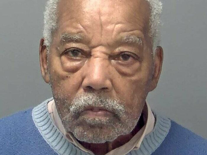 Elderly man with gray hair and beard wearing a blue sweater, a visual that might mess with your perception of time.