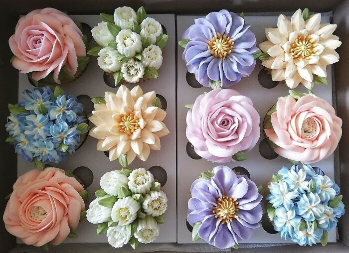 Assorted baked goods decorated as colorful, intricate flowers showcasing stunning baking artistry and design skills.